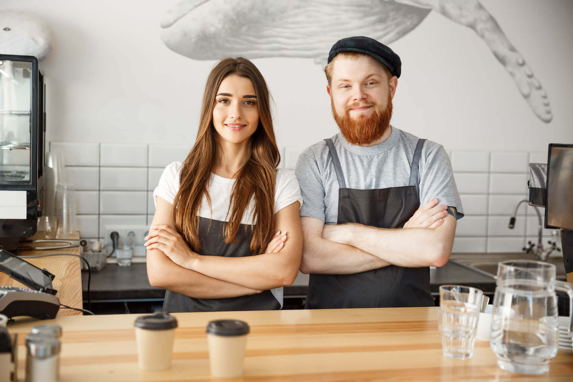 Two young cafe workers