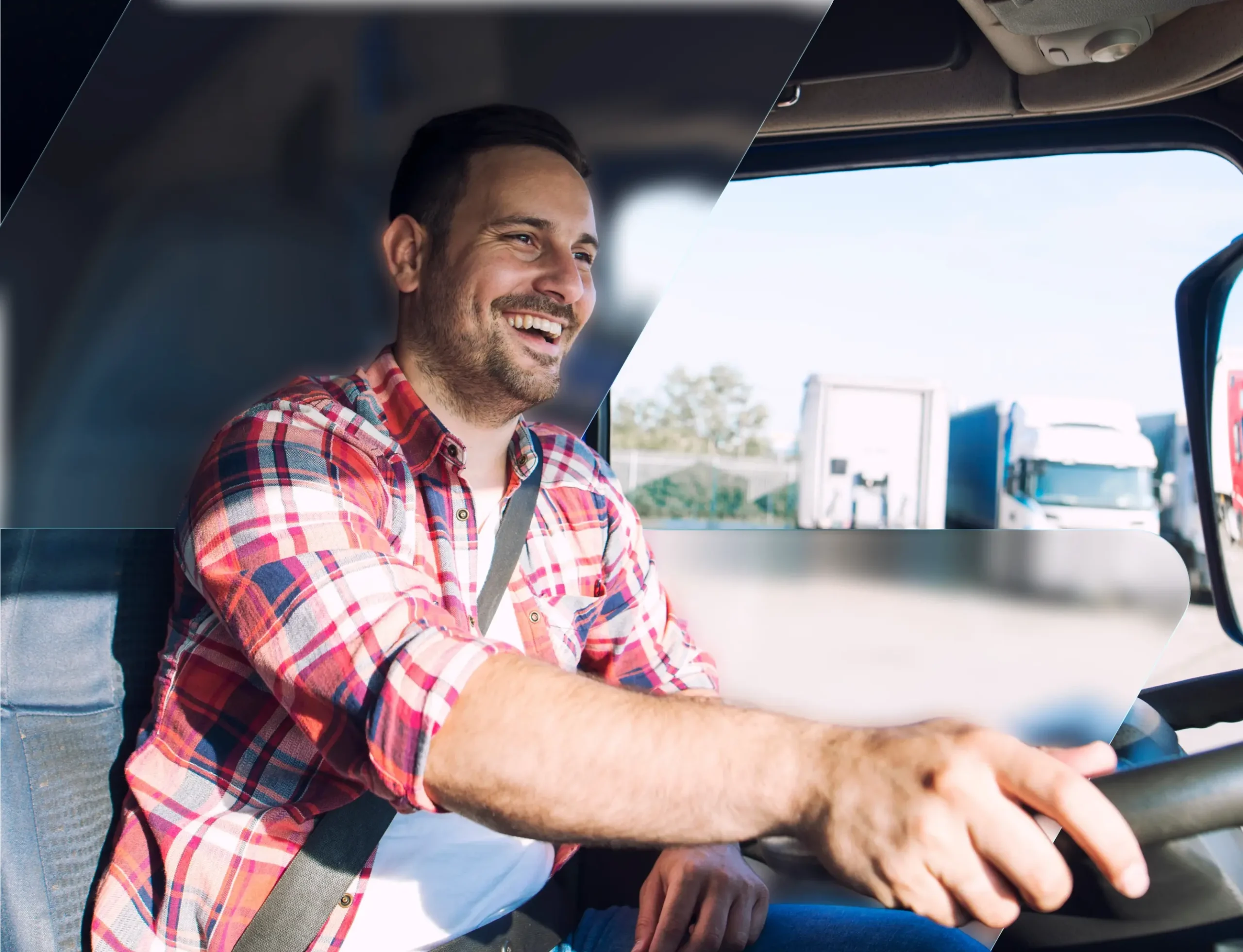 Truck driver smiling behind the wheel of his rig