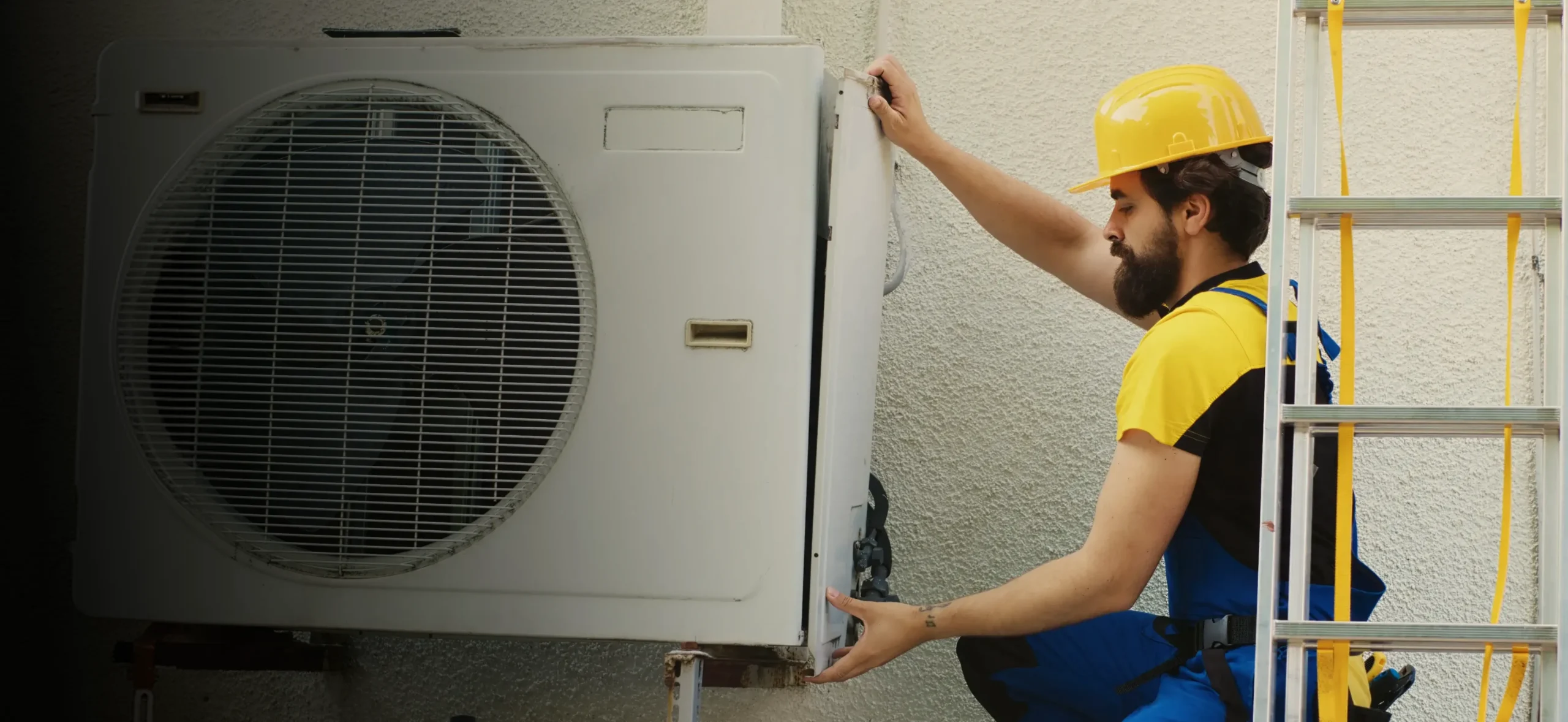 HVAC technician installing an outdoor condenser unit