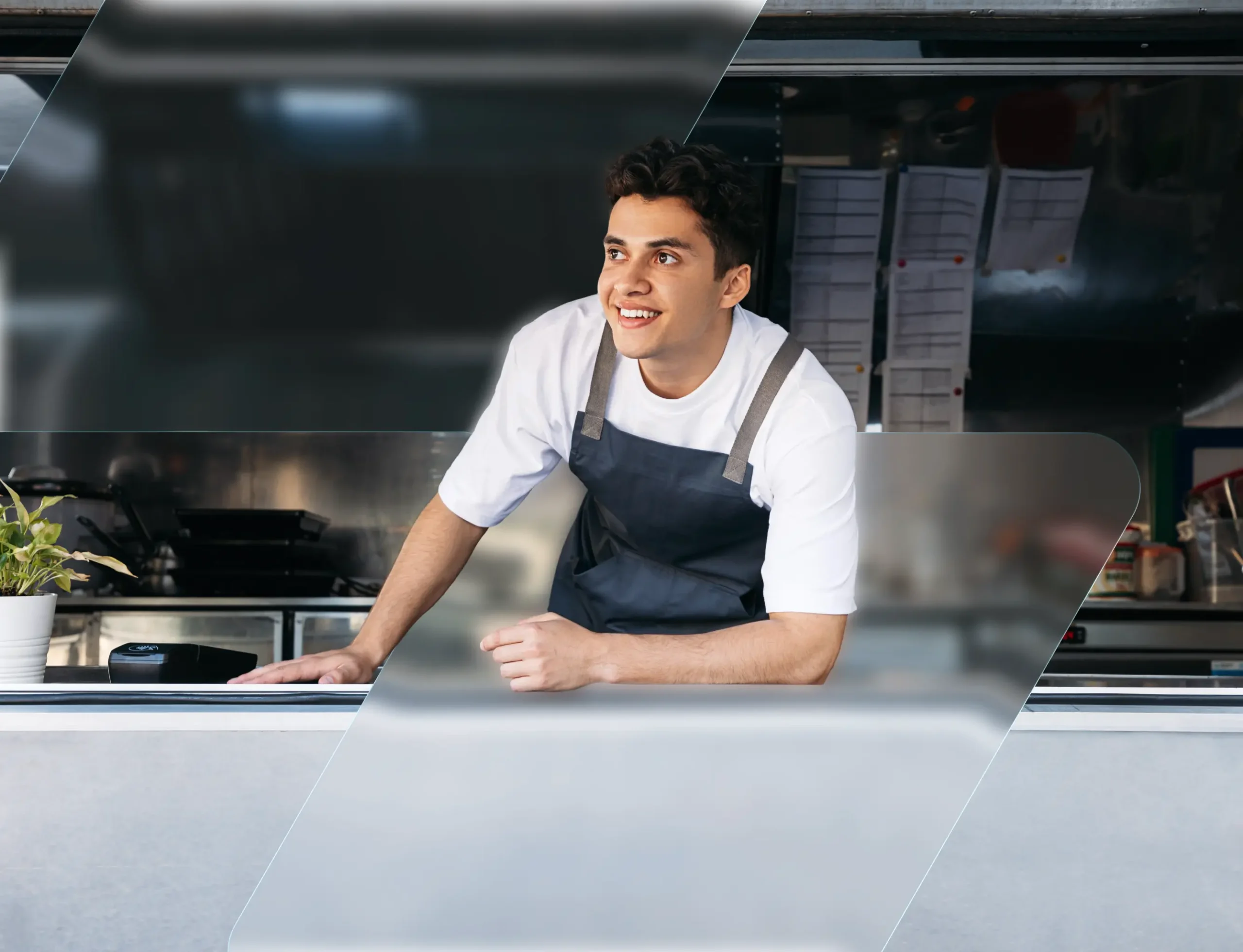 Food truck owner leaning on the service counter