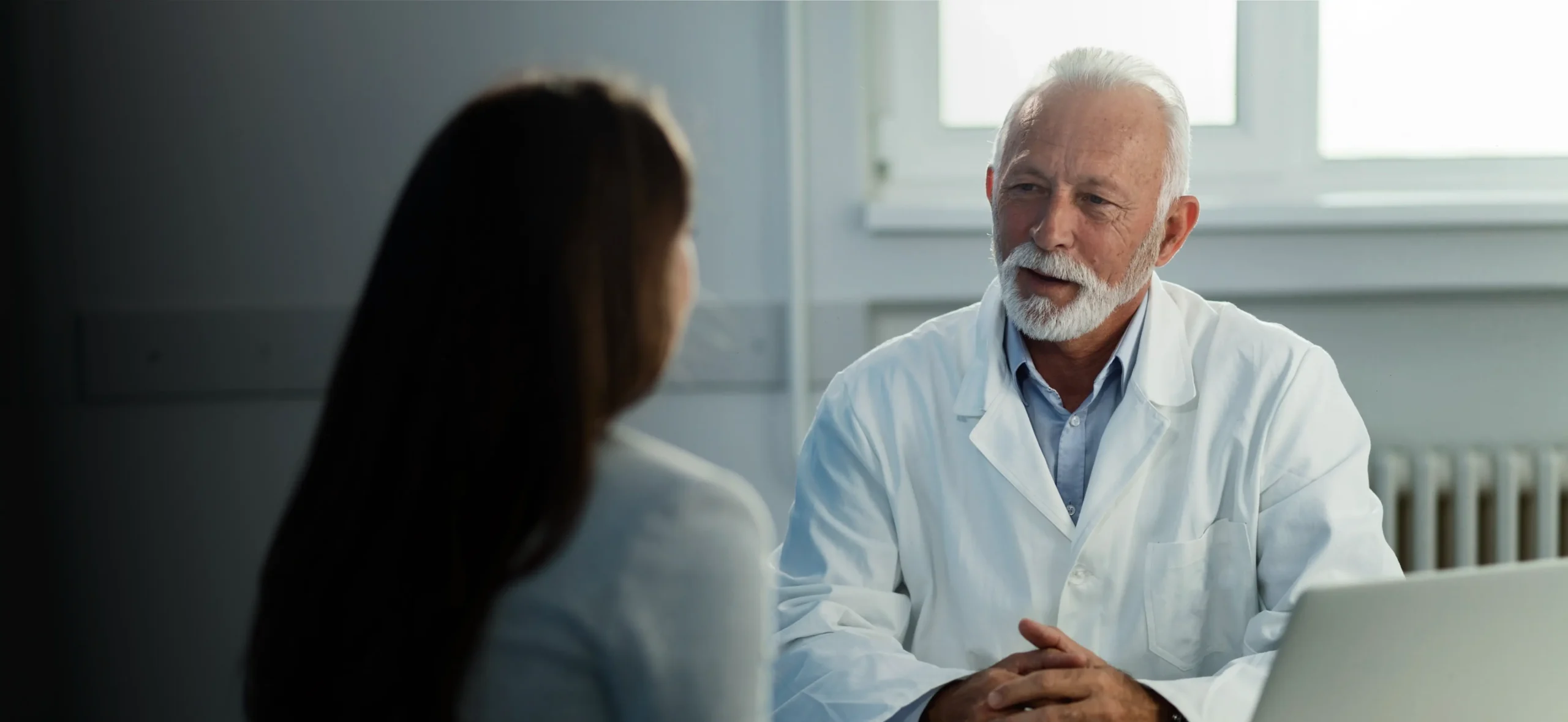 Doctor meeting with a patient in his office