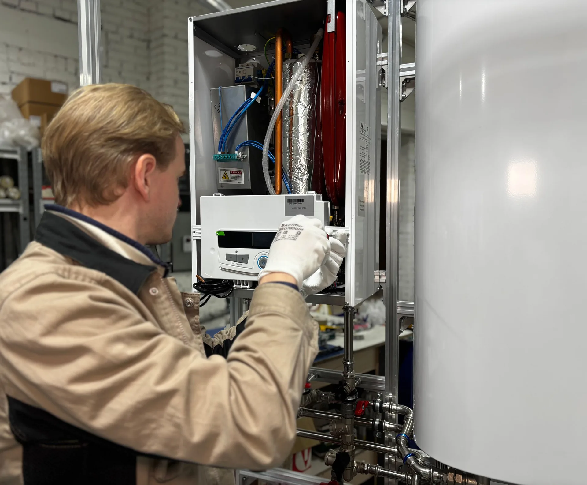 Plumber servicing a commercial water heater