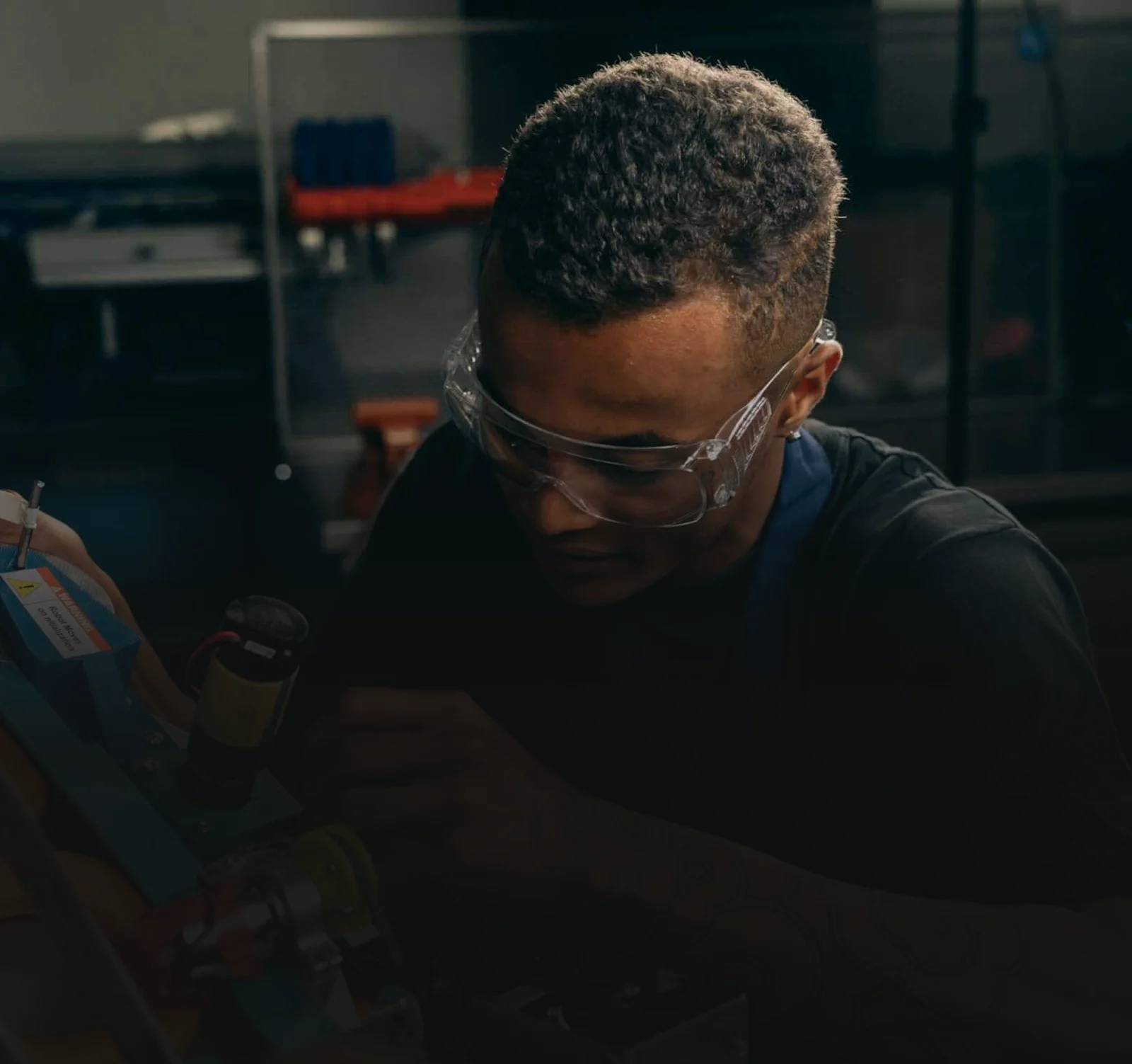 Technician in safety glasses working on new equipment