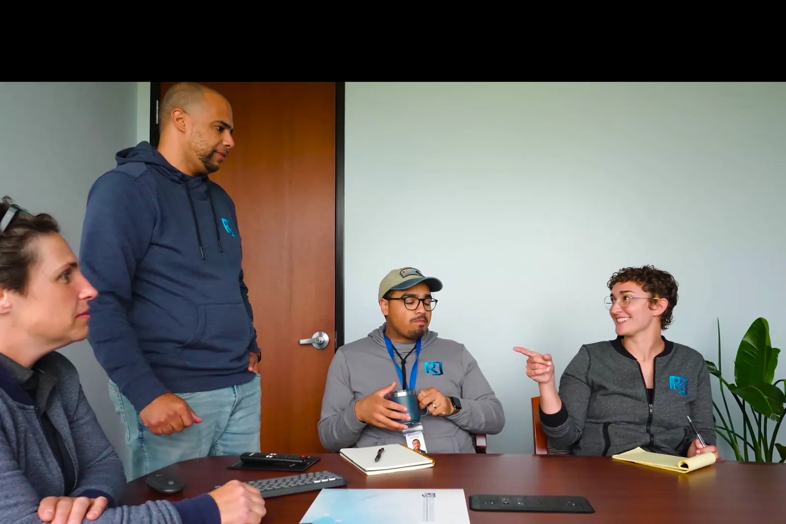 The RJ Telecommunications team in a meeting