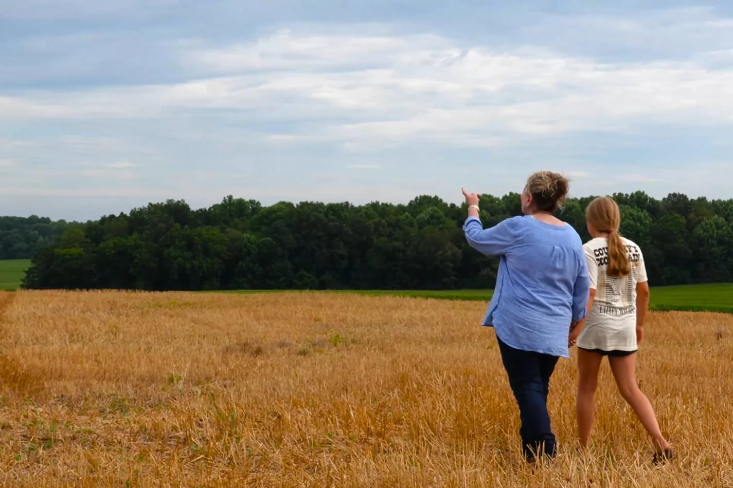 Donna Harrell walking a field near Smith Grain Company