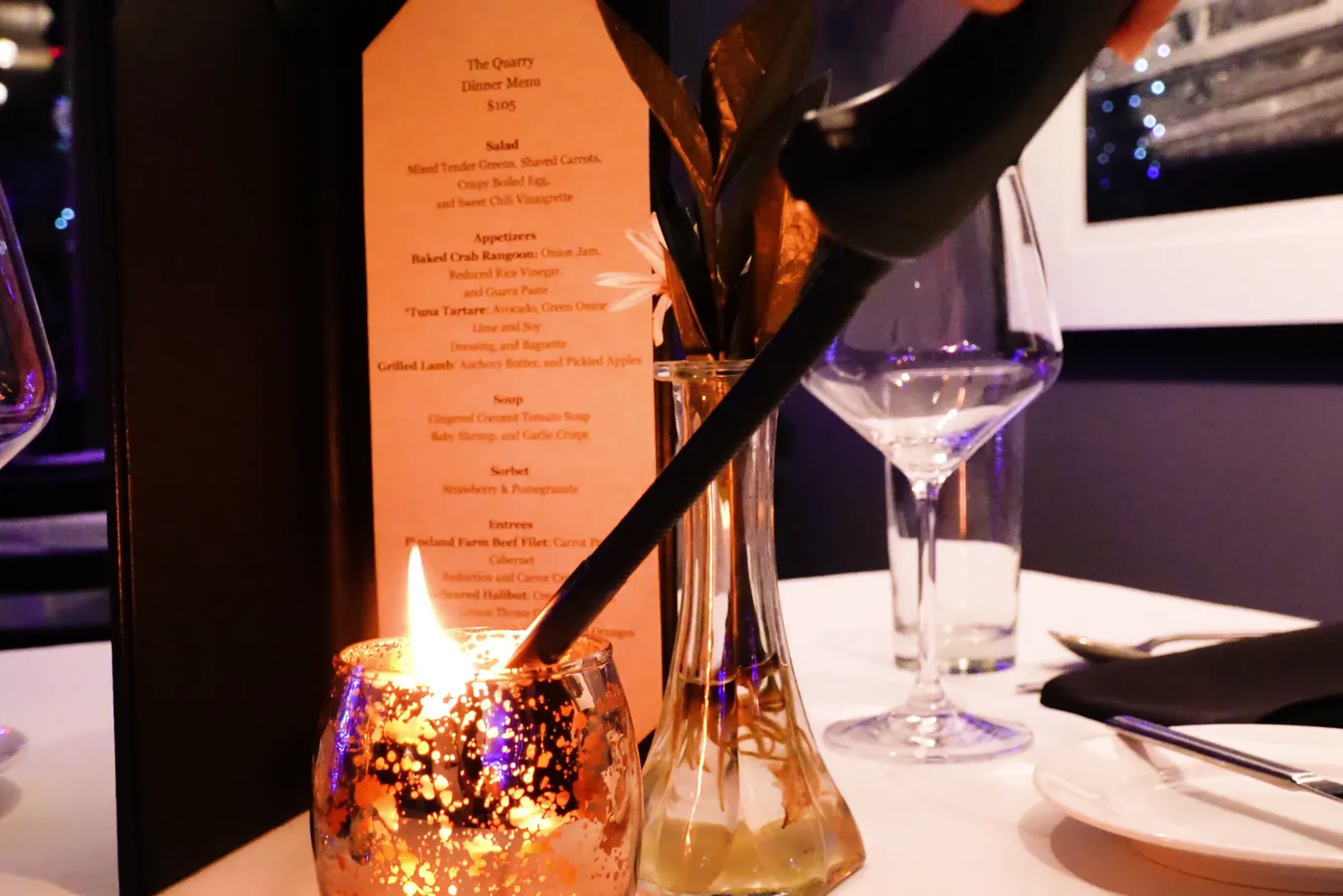 A candlelit table and menu at The Quarry