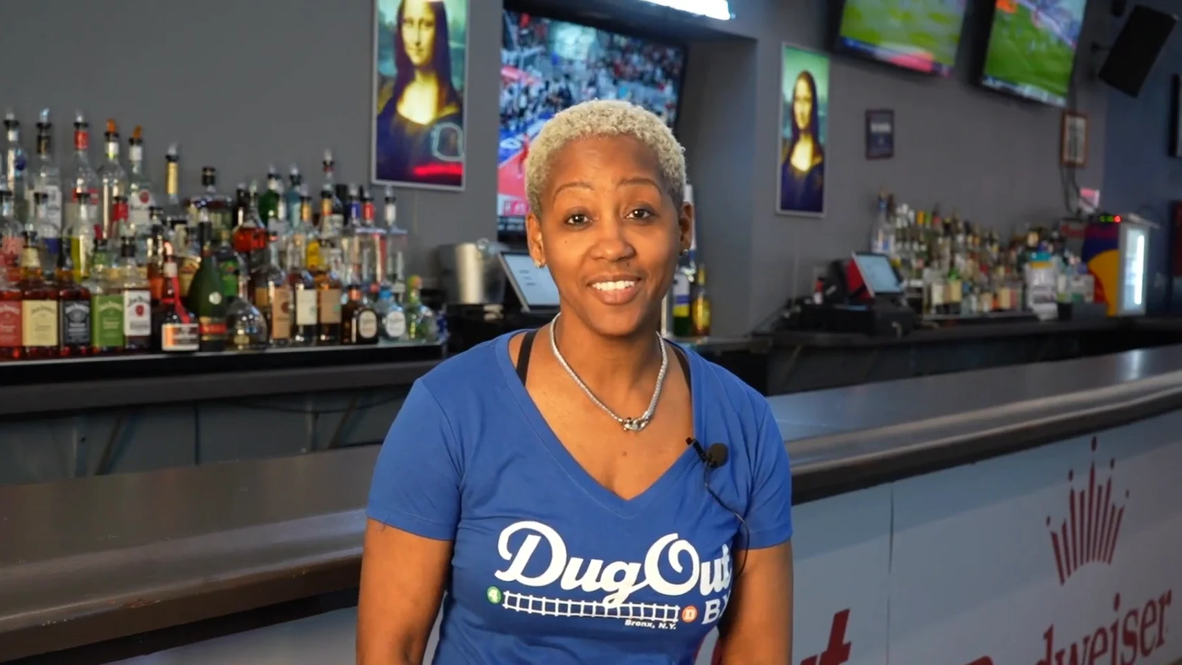 Sheila Smith, owner of The DugOut BX, behind her bar in the Bronx