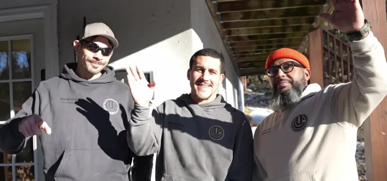 Omar Garcia and the Unlimited Concept crew outside a job site