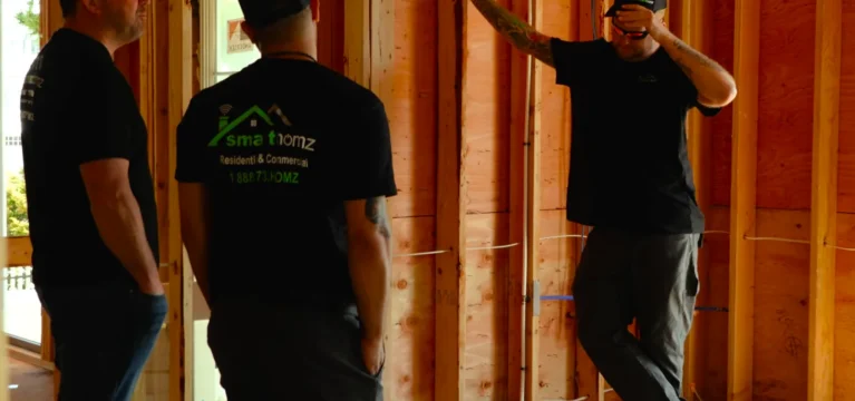 The Smart Homz crew walking through a home under construction
